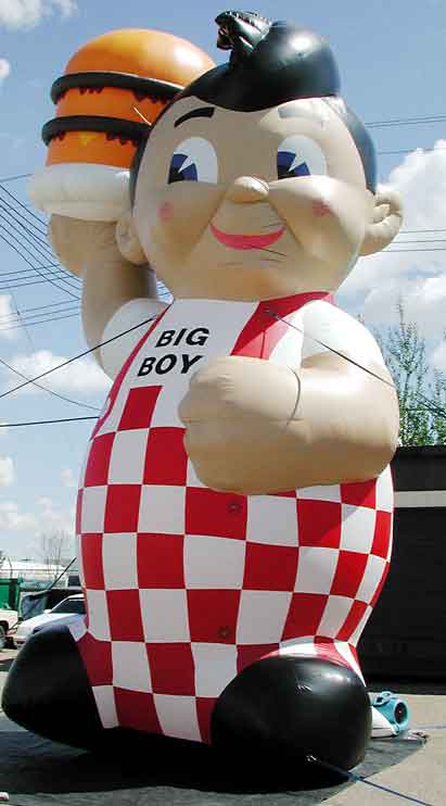 Giant inflatable big boy holding burger