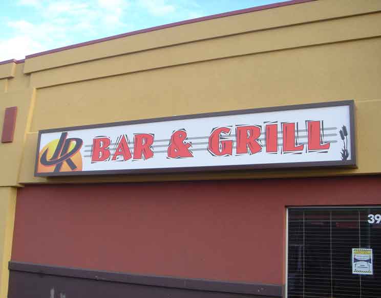 Printed sign for bar and grill